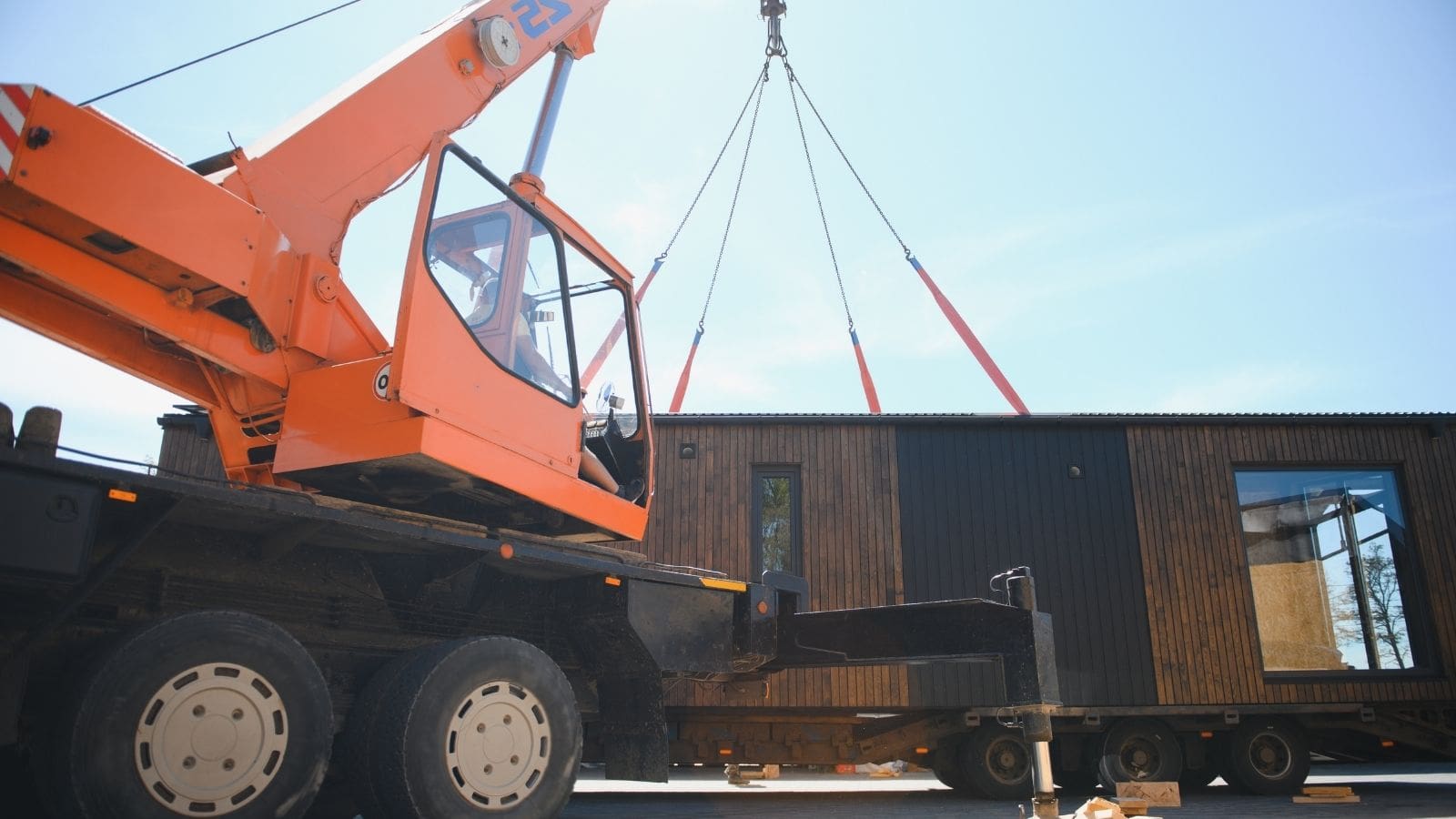 Prefabricated wall panels being assembled on site